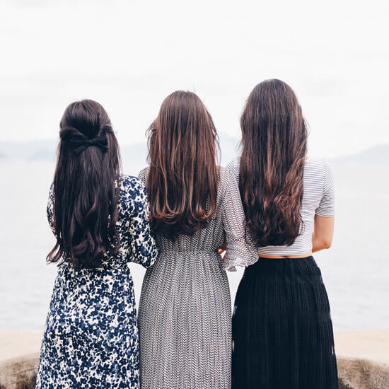 3 women standing together outside